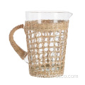 glass water with wicker rattan and handle